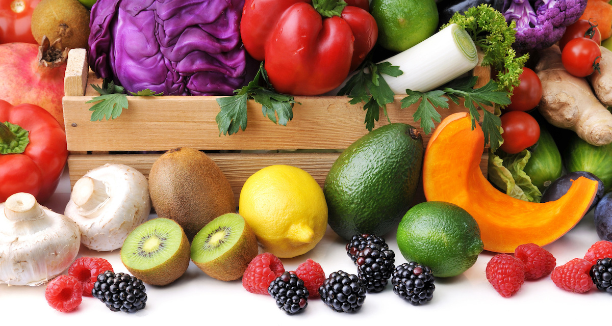 Mix of fresh vegetables, berry and fruit on white background.Concept of healthy eating.